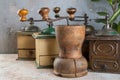 Old coffee grinders on concrete background Royalty Free Stock Photo