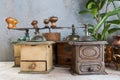 Old coffee grinders on concrete background Royalty Free Stock Photo