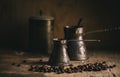 Old coffee pot and coffee bean on rustic wooden table. Vintage oriental coffee on dark background Royalty Free Stock Photo