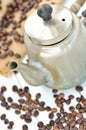 Old coffee pot spilled and spilled coffee beans Royalty Free Stock Photo