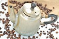Old coffee pot spilled and spilled coffee beans Royalty Free Stock Photo