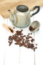 Old coffee pot spilled and spilled coffee beans Royalty Free Stock Photo