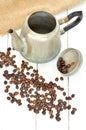 Old coffee pot spilled and spilled coffee beans Royalty Free Stock Photo