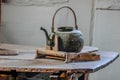 Old coffee or tea pot on wooden table