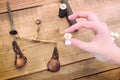 An old coin in a woman`s hand. Set to create retro silver money by minting. Scales and other tools for making coins