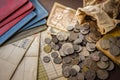 Old coins and bank book on grunge background. Royalty Free Stock Photo