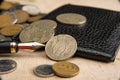 Old coins, fountain pen, wallet, cufflinks and more on a rustic wooden surface, selective focus Royalty Free Stock Photo
