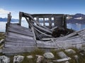 Old collapsed hut in front of a greenland scenery