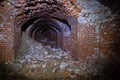 Old collapsed ruined underground red brick historical vaulted tunnel Royalty Free Stock Photo