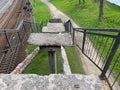 Old collapsed steps of a high railway bridge with holes. Broken dangerous bridge requiring urgent repair and closure