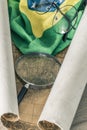 An old colonial map of South America and the flag of Brazil with a magnifying glass and old-fashioned glasses. Vintage style