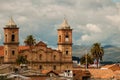 Old colonial stone church with roofs and palm tree Royalty Free Stock Photo