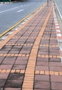 Old color Long paved brick footpath, Brick path or sidewalk with perspective going into the distance. Royalty Free Stock Photo