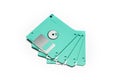 Old colored computer floppy disks on white background. Royalty Free Stock Photo