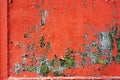 Old colored cracked wall. Grunge red wall texture for design. Colored cracked background
