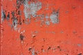 Old colored cracked wall. Grunge red wall texture for design. Colored cracked background