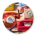 Old colored plastic analog phone in a flea market - Round icon concept image