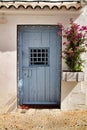 Old and colorful blue wooden door with iron details Royalty Free Stock Photo
