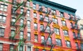 Old colorful buildings with fire escapes, New York City, USA Royalty Free Stock Photo