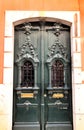 Old and colorful carved wood door with iron details Royalty Free Stock Photo