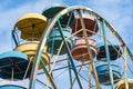 Old colorful ferris wheel in amusement park. Multicolour soviet carousel. Royalty Free Stock Photo