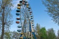 Old colorful ferris wheel in amusement park. Multicolour soviet carousel. Royalty Free Stock Photo