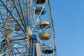 Old colorful ferris wheel in amusement park. Multicolour soviet carousel. Royalty Free Stock Photo