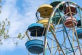 Old colorful ferris wheel in amusement park. Multicolour soviet carousel. Royalty Free Stock Photo