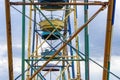 Old colorful ferris wheel in amusement park. Multicolour soviet carousel. Royalty Free Stock Photo