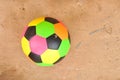 Old colorful football on cement floor