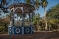 Old colorful gazebo of square in the middle of verdant garden full of trees, at sunset in SÃÂ£o Manuel.