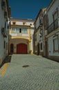 Old colorful houses in deserted alley on slope