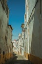 Old colorful houses with peeling plaster wall in a deserted alley Royalty Free Stock Photo