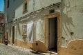 Old colorful houses with rough plaster wall and open door Royalty Free Stock Photo