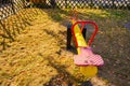 Old colorful seesaw in a playground during daytime