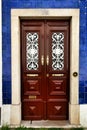 Old and colorful wooden door with iron details Royalty Free Stock Photo