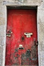 Old and colorful wooden door with iron details Royalty Free Stock Photo