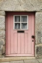 Old and colorful wooden door with iron details Royalty Free Stock Photo