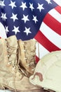 Old combat boots and helmet with American flag Royalty Free Stock Photo