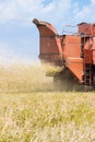 Old combine harvester removes wheat Royalty Free Stock Photo