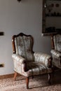 An old, ornate upholstered armchair