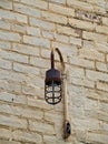 Old commercial light fixture on a brick building