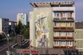 Old communist art on apartment block in Baia Mare