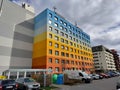 Old communist style block of flats with a rainbow colored facade