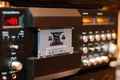 Old compact audio cassette in vintage audio system with tape rec Royalty Free Stock Photo