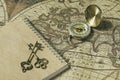 Compass, antique keys and notebook on blur vintage world map, journey concept, copy space Royalty Free Stock Photo