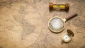 Old compass , magnifying glass and sand clock  on vintage map Royalty Free Stock Photo
