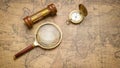 Old compass , magnifying glass and sand clock  on vintage map Royalty Free Stock Photo