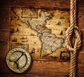 Old compass and rope on vintage map Royalty Free Stock Photo