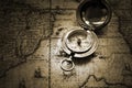 Old compass on vintage map Royalty Free Stock Photo